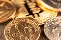 One US Dollar coin with Gold Bitcoin out of Focus. Digital Crypto Currency trading to USD