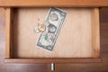 One US Dollar and coins in open drawer Royalty Free Stock Photo