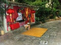 One of the vials in the gardens with the Goddess of Nature at Wat Sam Phran Temple