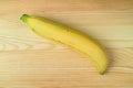 One Vibrant Yellow Ripe Fresh Banana Isolated on Wooden Background with Free Space Royalty Free Stock Photo