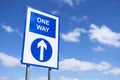 One way directional arrow sign against blue sky Royalty Free Stock Photo