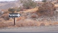 One way road sign arrow, highway roadside in California, USA road trip in desert Royalty Free Stock Photo