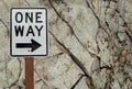 One Way Sign Against Rock Wall Background Royalty Free Stock Photo