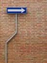 One way sign over a bricks wall Royalty Free Stock Photo