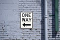 One Way Sign on Brick Wall Royalty Free Stock Photo