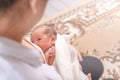 One week little baby girl feeding milk in mother arms. Mother embrace her daughter Royalty Free Stock Photo