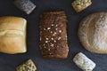 One wheat round bread with fiber on a black background. Royalty Free Stock Photo