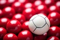 One white ball among many red ones, concept of individuality Royalty Free Stock Photo