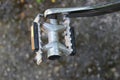 One white broken metal pedal on a bicycle Royalty Free Stock Photo