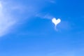 One white cloud in heart shaped on bright blue sky background Royalty Free Stock Photo