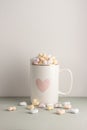 One white cup full of candy hearts Royalty Free Stock Photo