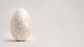 One white easter egg with beautiful gold floral pattern standing on light background. Generative AI Royalty Free Stock Photo