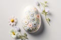 One white easter egg with beautiful floral pattern standing on light background. Generative AI Royalty Free Stock Photo