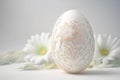 One white easter egg with beautiful floral pattern standing on light background. Generative AI Royalty Free Stock Photo