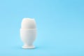 One white egg in egg cup with with an open top Royalty Free Stock Photo