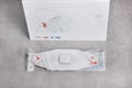 One white FFP3 face mask in vacuum package with box