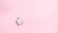 One white glass perfume bottle on a light pink background. with copy space Royalty Free Stock Photo