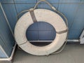 one white lifebuoy next to the pool