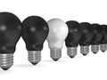 One white light bulb in row of many black ones Royalty Free Stock Photo