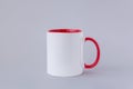 One white mug, red handle Royalty Free Stock Photo