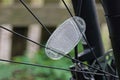 One  white plastic reflector on black metal wheel spokes Royalty Free Stock Photo