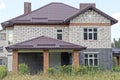 one white private brick house with a brown tiled roof Royalty Free Stock Photo