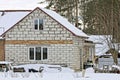 One white private brick house stands in the snow Royalty Free Stock Photo