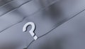 One White Question Mark put on a Grey Metallic surface with small hard waves and soft reflections Royalty Free Stock Photo
