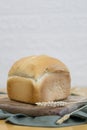 One white round bread with wheat fiber on the table. Royalty Free Stock Photo