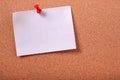 One white sticky post note pinned cork bulletin board background Royalty Free Stock Photo