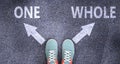 One and whole as different choices in life - pictured as words One, whole on a road to symbolize making decision and picking Royalty Free Stock Photo