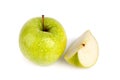 One whole big green apple and quarter of apple in water drops on white background isolated close up macro top view