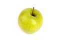 One whole big green apple in water drops on white background isolated close up macro top view Royalty Free Stock Photo