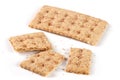 One whole and the broken grain crispbreads on white background Royalty Free Stock Photo