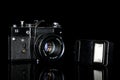 Vintage antique camera isolated on black glass