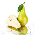 Conference pear with green leaf and one cut pear half on white background isolated close up Royalty Free Stock Photo