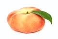 One whole flat peach with green leaf (isolated) Royalty Free Stock Photo