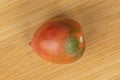 Fresh tomato de barao on light wood Royalty Free Stock Photo