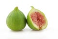 One whole green and sliced fig isolated on white background Royalty Free Stock Photo