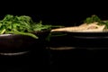 White parsley root on black glass