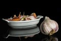 White organic garlic isolated on black glass Royalty Free Stock Photo