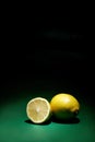 One whole and one halved lemon
