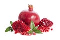 One whole and part of a pomegranate with pomegranate seeds Royalty Free Stock Photo