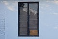 One window with a black frame on a white concrete wal Royalty Free Stock Photo