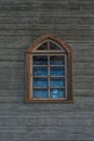 One window on a wooden church wall Royalty Free Stock Photo