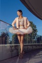 Dance Sport Ideas. Winsome Sexy Slim Professional Caucasian Ballet Dancer in Pink Tutu Dress Posing On Stairs Outdoor Royalty Free Stock Photo