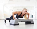 One woman doing abdominal push ups posture in gym Royalty Free Stock Photo
