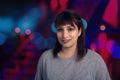 Woman portrait gray t-shirt blue and red bokeh lights circles out of focus background