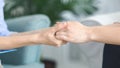 One woman holding other woman hands in supporting gesture Royalty Free Stock Photo