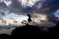 One woman jumping Floating up from the rock With a cloudy background similar to a tornado. : Mulayit Taung,Moei Wadi,Myanmar